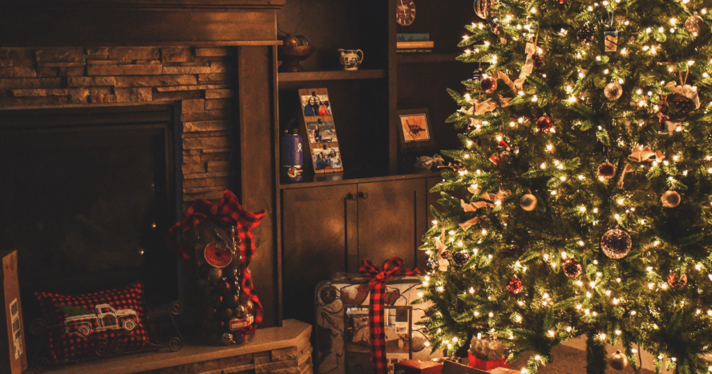 Christmas tree in front of a fireplace