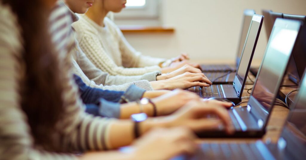 Typing | Pathways Career College Students learning to type on laptops